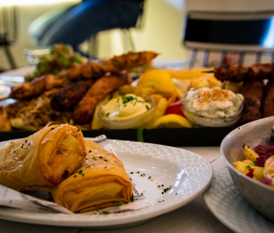 Fried cheese bourekakia and grilled meat platter with fries