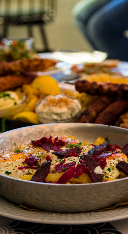 Fries with eggs, beets, and sauce