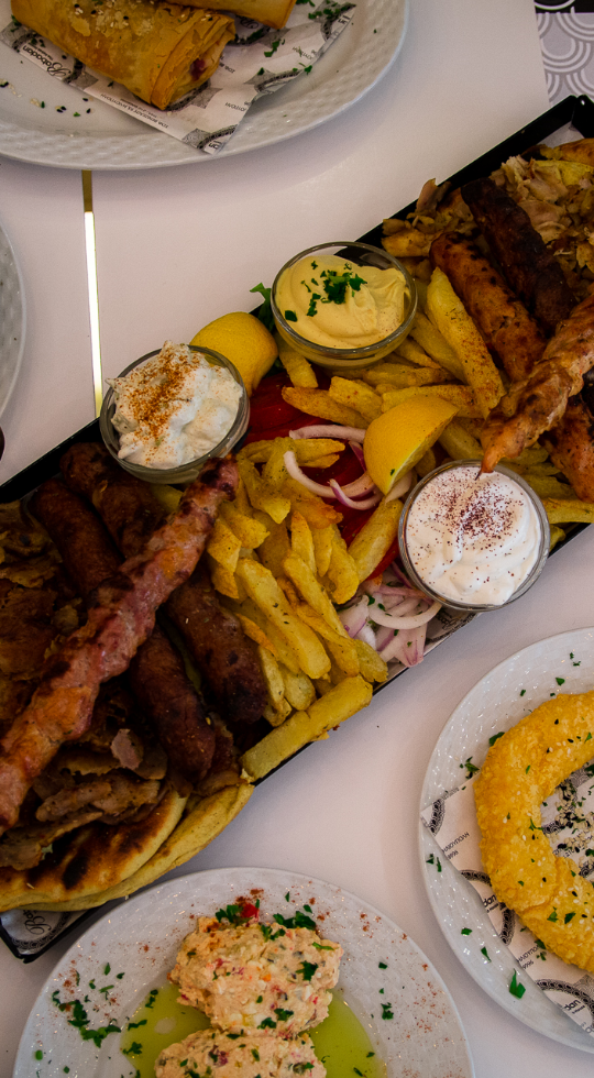 Grilled meat mix with fries and other appetizers