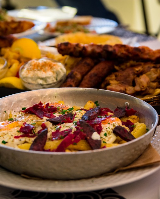 Fries with eggs, beets, and sauce