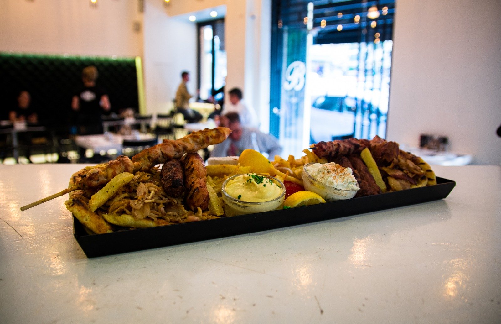 Grilled meat mix with fries and sauces Grilled meat mix with fries and sauces